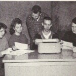 In the Fall of 1960 students decided to restart the school newspaper and name it The Prospector. Shown here in October 1960 are Typist Sue Guy, Co Editor Judy Chitwood, Editor in Chief Cecil Goff, Sports Editor Tommy Wheeler (standing) and News Editor Herbert Beasley. Superintendent Howard Moore did not schedule them a Journalism Class, a room or corner of a room for their materials, or time to leave school to sell ads. They got together in their spare time in the library or a study hall room and ran it off on the school mimeograph machine. A typical paper was four pages and came out once a month. Elaine Cornell was their unofficial faculty "encourager." They were not able to produce the kind of award winning paper Ferguson had been known for in the past. But these five students at least re-established a school newspaper. When H. T. Higgins took over as superintendent he scheduled a Journalism class and hired a qualified teacher to both teach the class and sponsor the student newspaper. Thanks to these five students and the support of Higgins, Ferguson continued to have a school newspaper until the school closed.