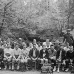The annual field trip to Mammoth Cave. This photo is taken at the Historic Entrance just prior to the three hour underground tour. The two rangers with the park service hats led the group. This trip was held in May but the jackets and sweaters they are wearing are because of the year round 60 degree temperatures underground. Most Ferguson students had never been in a cave before this tour. From 1920 to 1960, Ferguson held annual field trips to Cumberland Falls, Cumberland Gap, Mammoth Cave, Washington D.C. and Fort Lauderdale, Fla. As the school moved into the 1960s, it began cutting one of these trips a year until by the 1966-67 school year there were none. The Mammoth Cave trip was not overnight; they left Ferguson at 7:30 a.m. and returned after dark. =