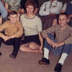 Vernon Norris, left, and Billy Brewster, right, pose with teacher Elaine Thornton Holder in December 1966. Billy was the center and Vernon a hot shooting guard on the greatest seventh grade team in Ferguson's 58 year history. Their team rolled undefeated through the entire season, averaged over 70 points per game, scored in the 80s five times, won the 47th district and 12th region championships, was ranked number one in the state from January 1 on, and did not lose until the state finals before 9000 fans in Diddle Arena. Vernon was sick and without his 20 points per game and defensive skills on the team's 1-2-1-1 full court press, Ferguson lost 41-29. The other starters on that seventh grade team were Gene Burton, Larry Burton, and Eddie Tucker. Dennis Whitaker, Ronnie Vaughan, Gerry Holsombach, Jimmy Denney and Doug Strunk were reserves who, because of the team's fast breaking and full court pressing style, played about as many minutes per game as the starters. Earl Ruby of the Louisville Courier Journal, who covered junior and senior high tournaments for 48 seasons, wrote that it was the greatest seventh grade team ever seen in Kentucky. Unfortunately, none of these boys ever played a minute for Ferguson High School. When the school closed, they scattered to other high schools. Vernon Norris, left, and Billy Brewster, right, pose with teacher Elaine Thornton Holder in December 1966. Billy was the center and Vernon a hot shooting guard on the greatest seventh grade team in Ferguson's 58 year history. Their team rolled undefeated through the entire season, averaged over 70 points per game, scored in the 80s five times, won the 47th district and 12th region championships, was ranked number one in the state from January 1 on, and did not lose until the state finals before 9000 fans in Diddle Arena. Vernon was sick and without his 20 points per game and defensive skills on the team's 1-2-1-1 full court press, Ferguson lost 41-29. The other starters on that seventh grade team were Gene Burton, Larry Burton, and Eddie Tucker. Dennis Whitaker, Ronnie Vaughan, Gerry Holsombach, Jimmy Denney and Doug Strunk were reserves who, because of the team's fast breaking and full court pressing style, played about as many minutes per game as the starters. Earl Ruby of the Louisville Courier Journal, who covered junior and senior high tournaments for 48 seasons, wrote that it was the greatest seventh grade team ever seen in Kentucky. Unfortunately, none of these boys ever played a minute for Ferguson High School. When the school closed, they scattered to other high schools.