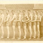 Ferguson players pose after winning the district title at the Somerset High School gym in March 1929, beating Somerset 44-40 in the finals. Both the district winner and runnerup went on to regionals, where there was a blind draw for seedings. In the first game of the region, Somerset and Ferguson drew each other again. Ferguson won 40-38. But in the regional semifinals, Stanford beat Ferguson 43-39. The Warhorses finished the year 19-4.
Backboards were wood, and the foul lane was only half as wide as it is now. After each team scored, a jump ball was held at center court to determine possession.
Four members of this team played college ball at Centre College, Eastern State Normal College, Kentucky Wesleyan (then located in Winchester), and Western State Normal College. A fifth, Jackie Meece, entered Kentucky University in Lexington and tried out for the team under its new coach from Illinois---Adolph Rupp. He qualified for the team, but in December separated a shoulder and never played again. This was the first Ferguson team to play in the new gym. This was also the first year for Ferguson to host the district tournament.