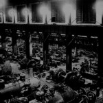 This is another view of the engine house, showing the wheeling annex. In the yard photo above, this is the smaller section of the engine house, which is the building furthest to the left. While the main crew was working on the boiler and seals, "wheelers" would be replacing the wheels, axles and driving rods. A "wheeler" was a certified railroad machinist who took additional training in how to perfectly round and balance a wheel or axle, and how to balance and fit a driving rod. If a wheel was as much as an ounce out of balance or a sixteenth of an inch out of true, it would set up unnatural wear patterns out on the rails and drastically shorten the life of that engine. Another job a "wheeler" might be asked to do when he had a spare moment was to produce ball bearings. It was a simple job that required incredible precision. A ball bearing had to be perfectly round. Today, 60 years later, with all our modern technology, producing a perfect ball bearing is a challenge. It was a routine job in the Ferguson Shops.