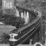This cover of Ties Magazine celebrates the introduction of a whole new kind of locomotive, the diesel electric. This is its maiden voyage on the Southern Railroad. Notice this is a four unit engine. The front unit has the controls and the other three are "helper" units. This is the tunnel and Cumberland River Bridge at Burnside before the lake was backed up. No one realized it at the time, but this was the end of the Ferguson Yard. As they ran the new engines up and down the route, railroad officials soon realized it did not need servicing as often. An engine could go all the way from Cincinnati to Chattanooga, or from Atlanta to Ferguson, between stops. Therefore, a huge savings could be realized by eliminating one of the yards. For two years officials studied the situation before deciding that it would be the Ferguson Yard that would be phased out.
The fireman leaning out of the cab is Charles F. Denny of Ferguson. His father, also Charles F. Denny, was Chief Dispatcher on the Southern Railroad's Somerset Section. Soon after this photo was taken, the son enlisted in the Marines and was killed in action after one year of active duty.
Ties Magazine was mailed free of charge every month to all employees of the Southern Railroad.