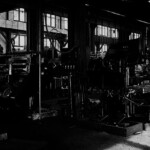 This is the Heavy Fabrication Wing. Here a good machinist could make any part needed. The big machine to the right is a state of the art drill press. Notice all the small wheels and "X" cranks. They were used by the operator to adjust various angles. The machine behind it was a Flanger, used to form curved parts. A machinist could operate any one of these machines, but he would specialize in one. In some locations men might move from one machine to another, but Ferguson had a large workforce so one man would rarely leave his specialty. He could be a Drill Press Operator for 30 years. These were very expensive machines and when the Southern Railroad closed the Ferguson Shops they loaded all of them very carefully onto flatcars and hauled them down to Chattanooga. Some of them are still in use. You can see them at the Chattanooga Rail Center.