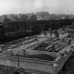 Railroad stations and trackside buildings had to be built much stronger than other structures because the trains passing so close several times a day set up vibrations in the ground or the rock layers which could be destabilizing. Close attention was paid to foundations, corners, wall tie ins and roof beams. Joints had to be fitted with less tolerance and bolts, dovetails and mortises had to be tight but with a little spacing so the vibrations could pass through the building without damaging it.